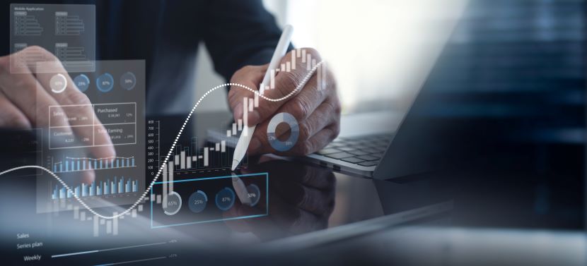 Hands using a stylus on a tablet with overlaid graphics of charts, data points, and analytics dashboards.