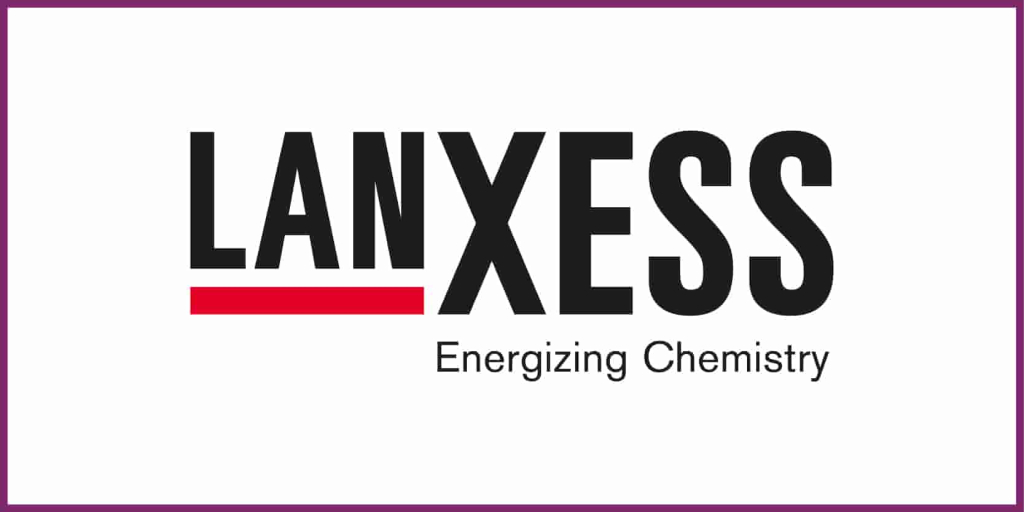 ITVT‑themed visual showing the LANXESS logo with bold black lettering, a red underline beneath the first part of the name, and the tagline ‘Energizing Chemistry,’ all framed by a thin purple border.