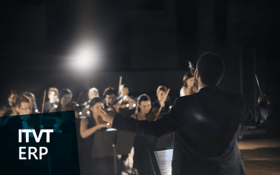 A conductor leading an orchestra during a performance, with musicians playing various instruments on stage. The scene conveys coordination, harmony, and teamwork. The ITVT ERP logo appears in the lower left corner.