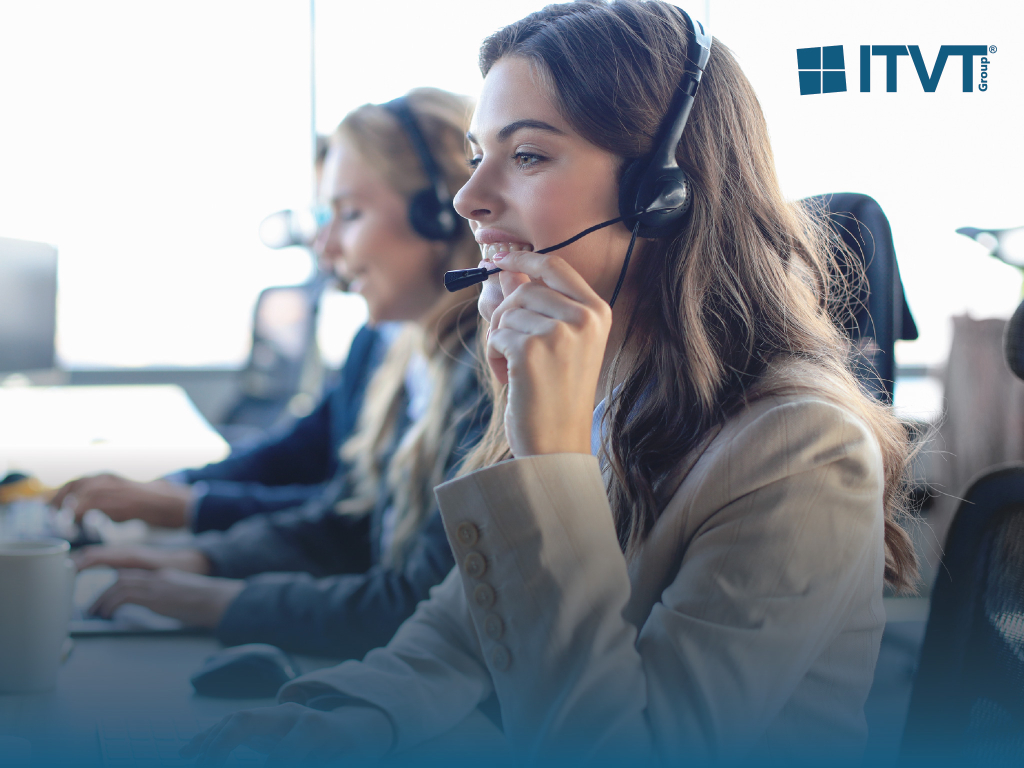 Three call center employees wearing headsets, with a smiling young woman in the foreground, are working on computers. The ITVT Group logo appears in the upper right corner.